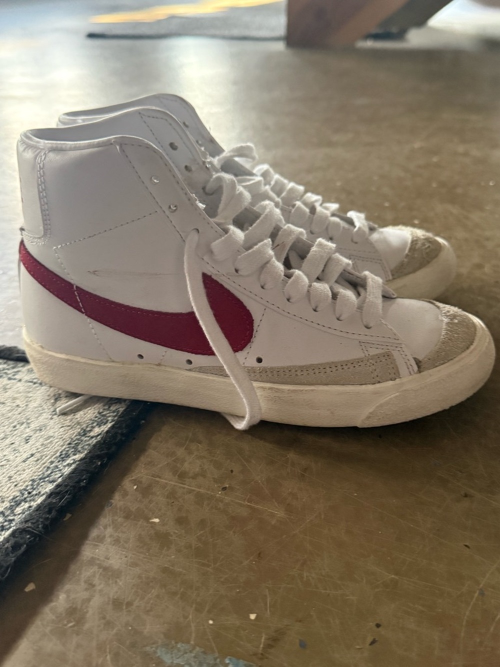 Nike High-Top Sneaker with White Upper and Red Swoosh